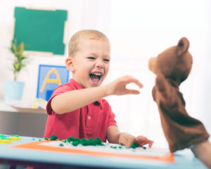 Boy Smiling with Teddybear